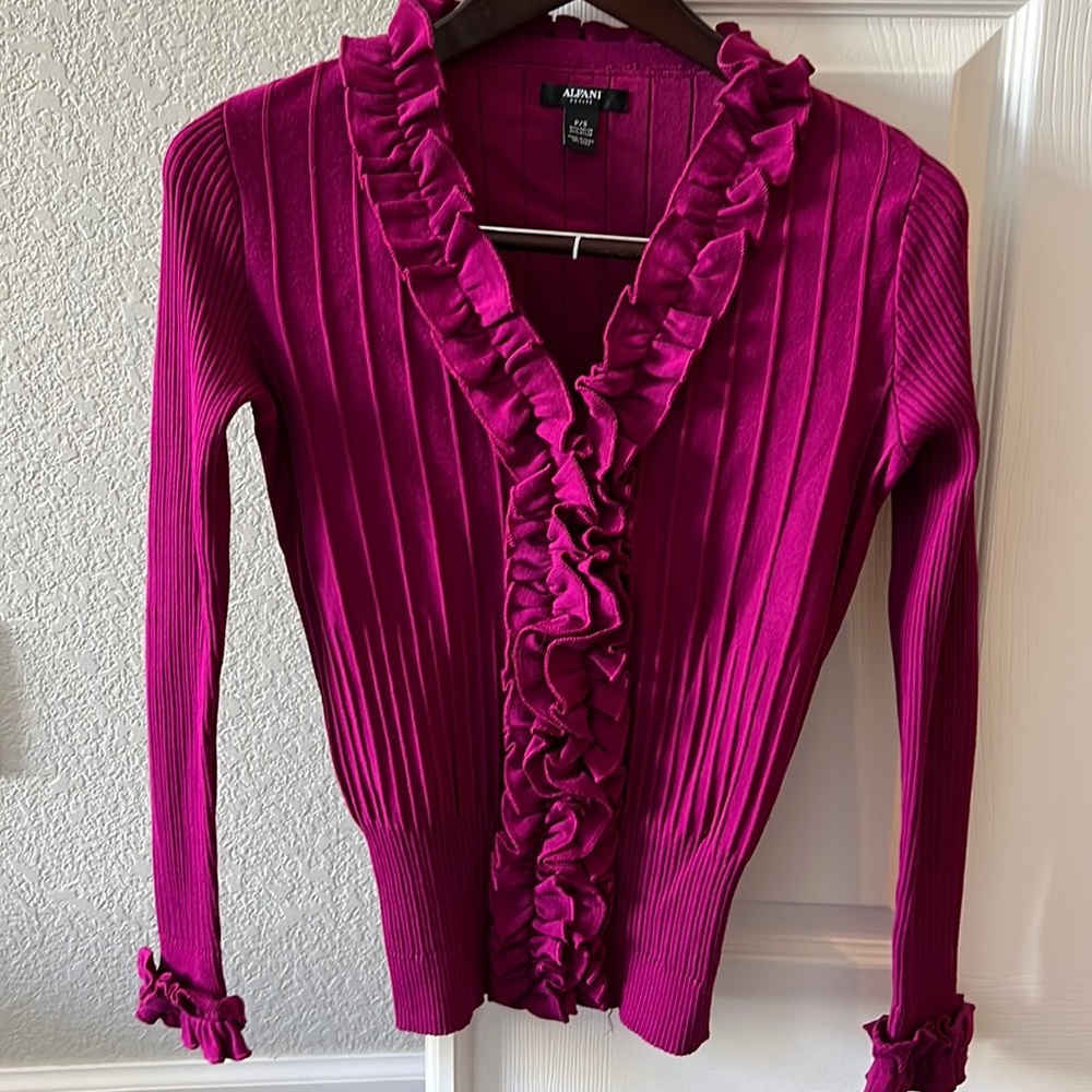 Alfani sweater with ruffles at collar, placket and cuffs. Size small.